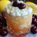 creamy cherry vanilla amaretto sour mocktail - featured image